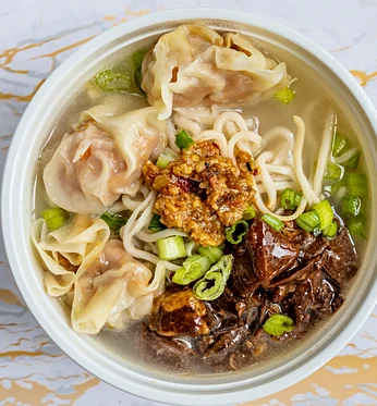 Beef wonton soup with egg noodles, braised beef and scallions
